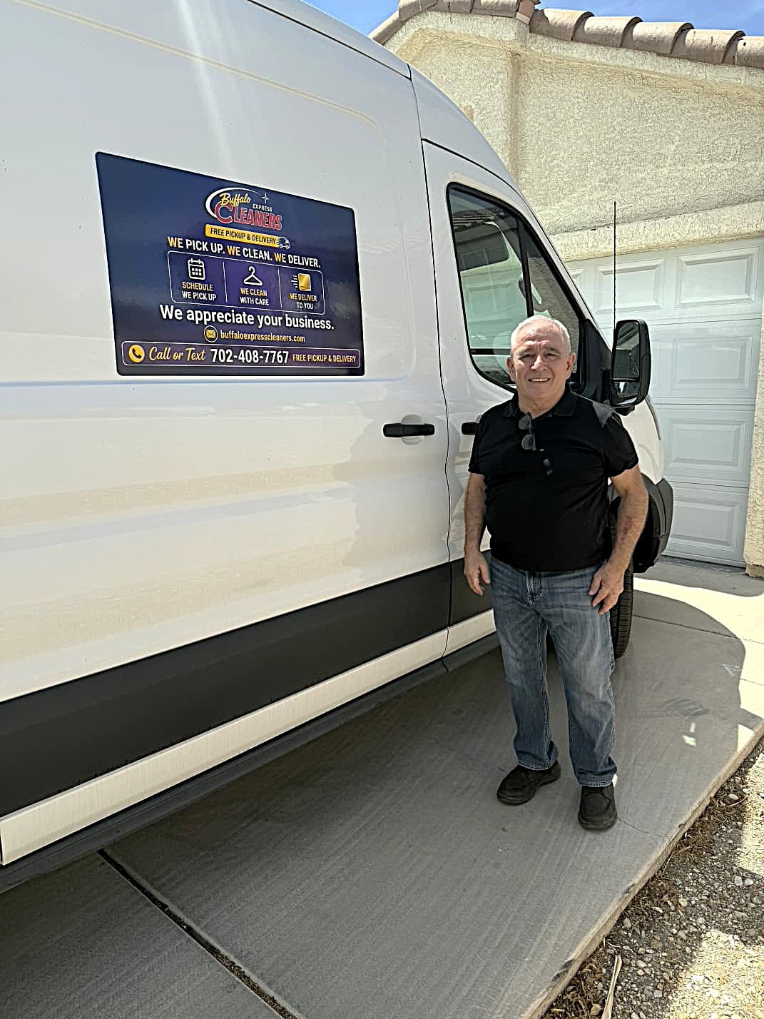Miguel, owner of Buffalo Express Cleaners, standing beside the company delivery van in Northwest Las Vegas.